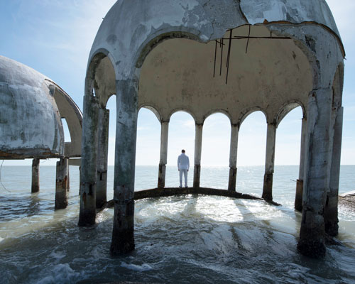 simon faithfull roams the water-bound ruins of a futuristic beach house in florida