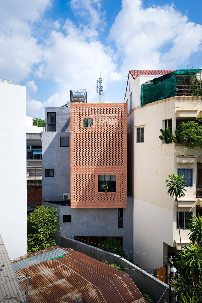  tropical space combines perforated clay brick + concrete for NDC house in vietnam