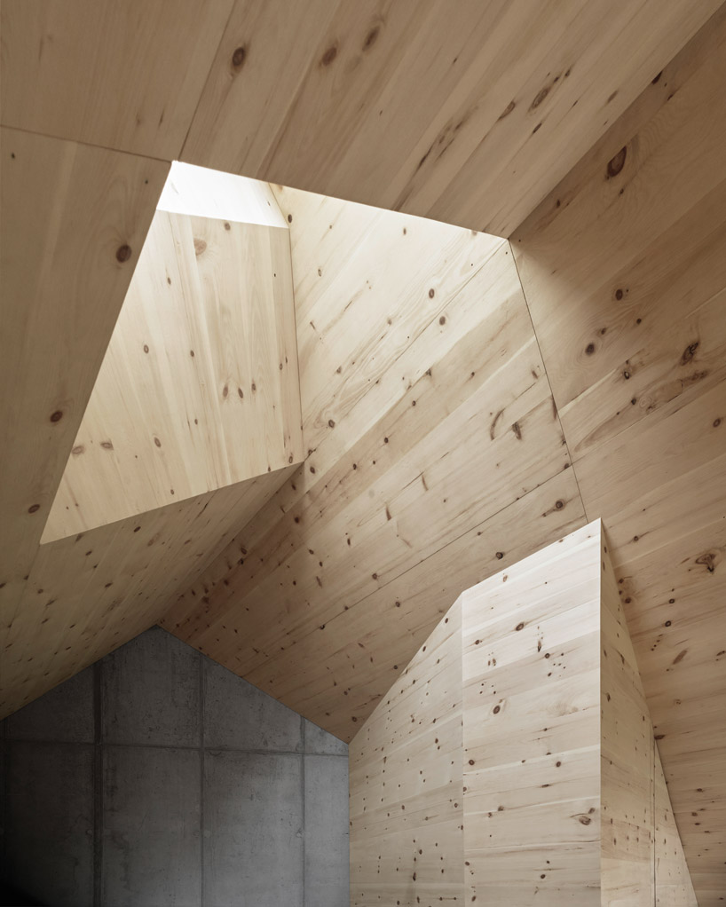 AFGH folds an asymmetrical roof over 'house ribetschi' in rural switzerland designboom