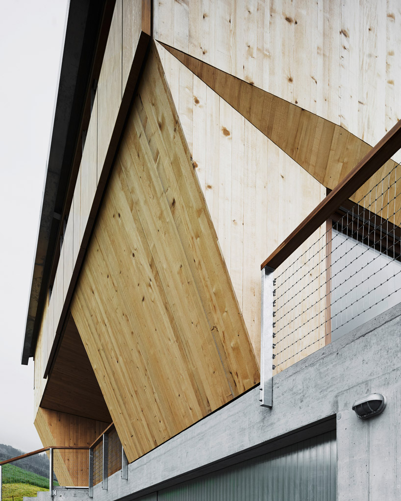 AFGH folds an asymmetrical roof over 'house ribetschi' in rural switzerland designboom