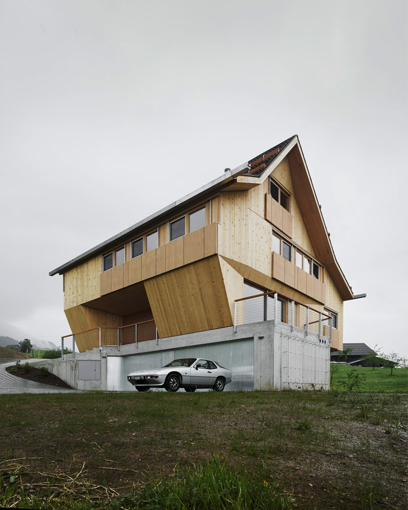 AFGH folds an asymmetrical roof over 'house ribetschi' in rural switzerland designboom