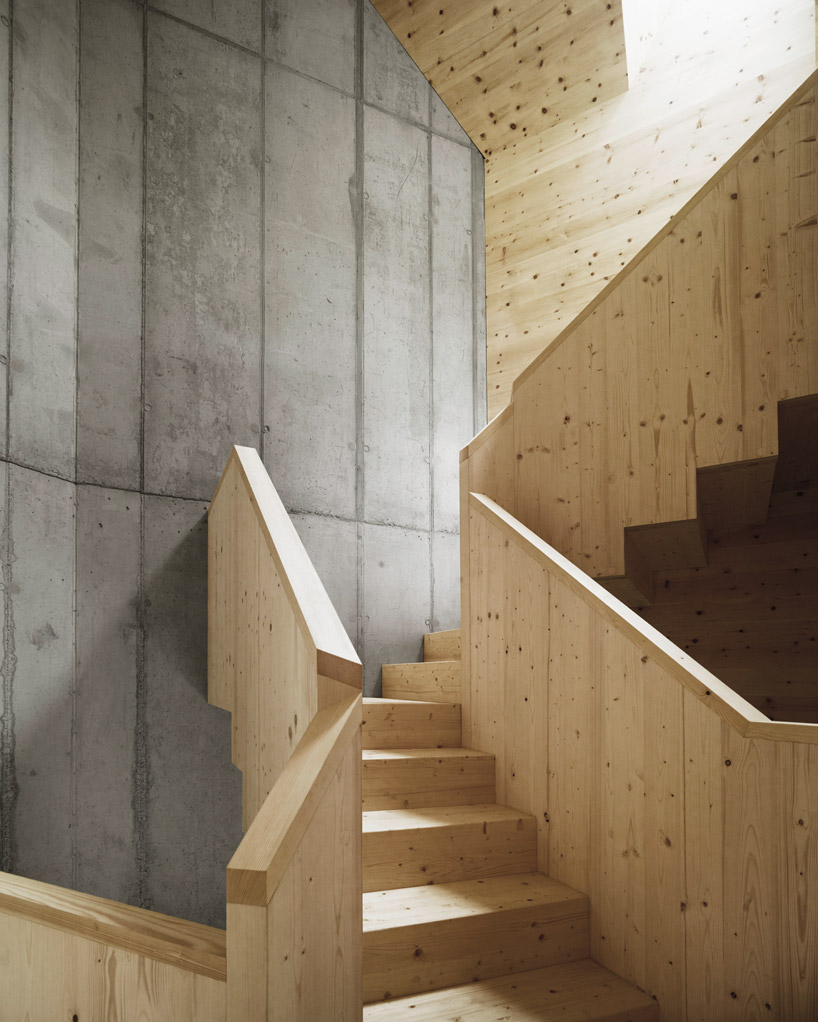 AFGH folds an asymmetrical roof over 'house ribetschi' in rural switzerland designboom