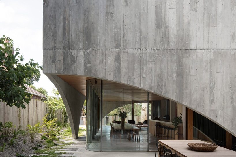 edition office combines pair of arched concrete shells for house in hawthorn, australia