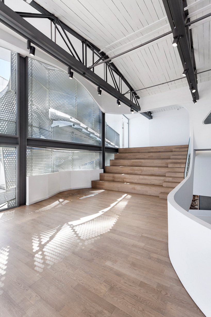  klab architecture completes pharmacy with triangular perforated façade in piraeus, greece