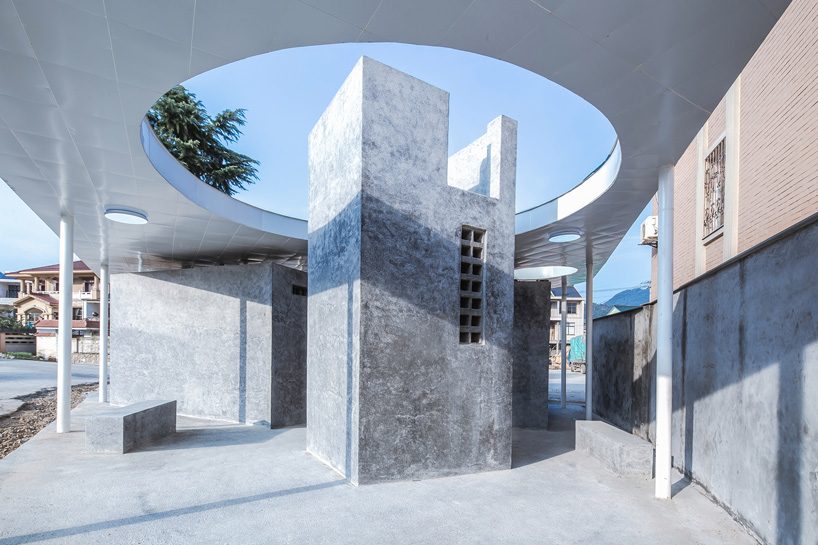  shulin architectural design unites individual blocks under curved roof for public toilet in china
