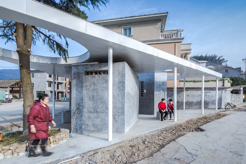  shulin architectural design unites individual blocks under curved roof for public toilet in china