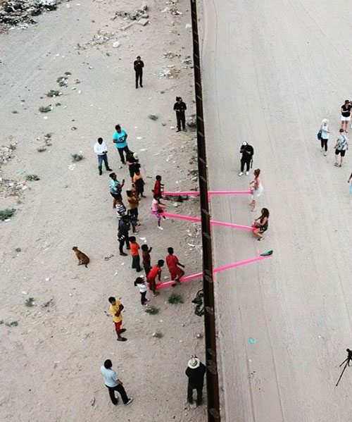 rael san fratello installs pink seesaws on USmexico border wall