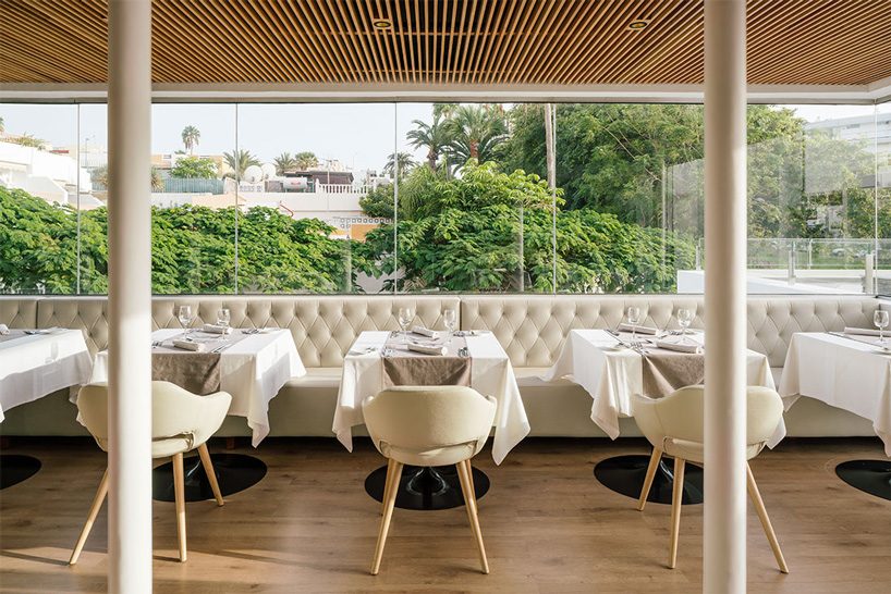 zooco estudio's flamingo club hotel in tenerife combines bamboo, basalt stone + white hues