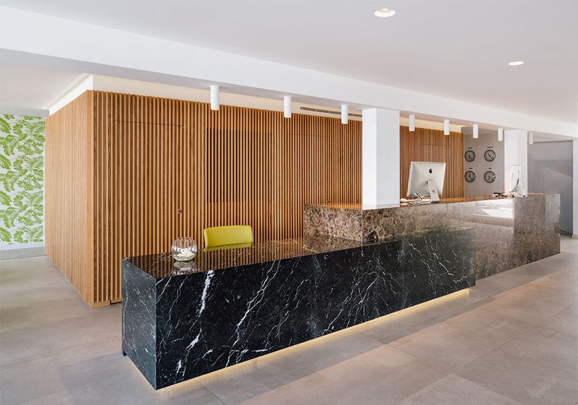 zooco estudio's flamingo club hotel in tenerife combines bamboo, basalt stone + white hues