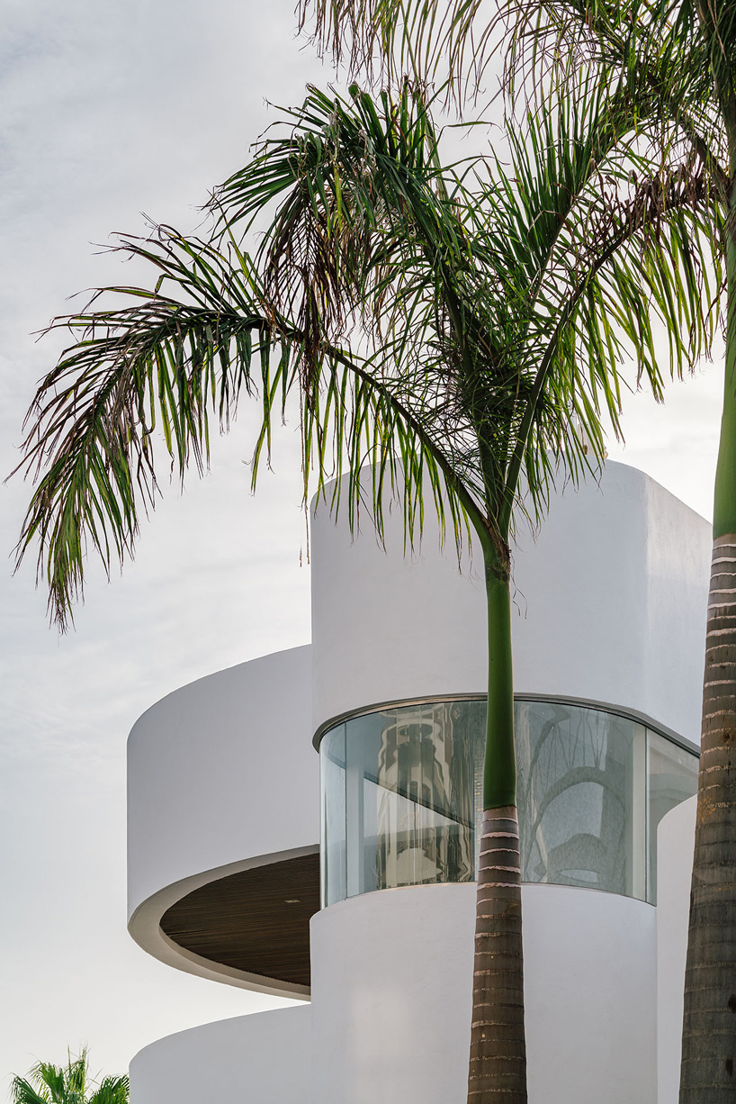 zooco estudio's flamingo club hotel in tenerife combines bamboo, basalt stone + white hues