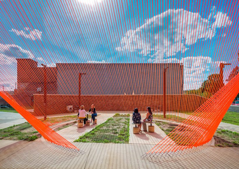 behin ha builds temporary shade installation in ohio using scrap mesh fabric