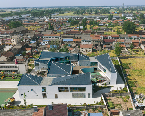 crossboundaries designs network of buildings to form village-like kindergarten in rural china
