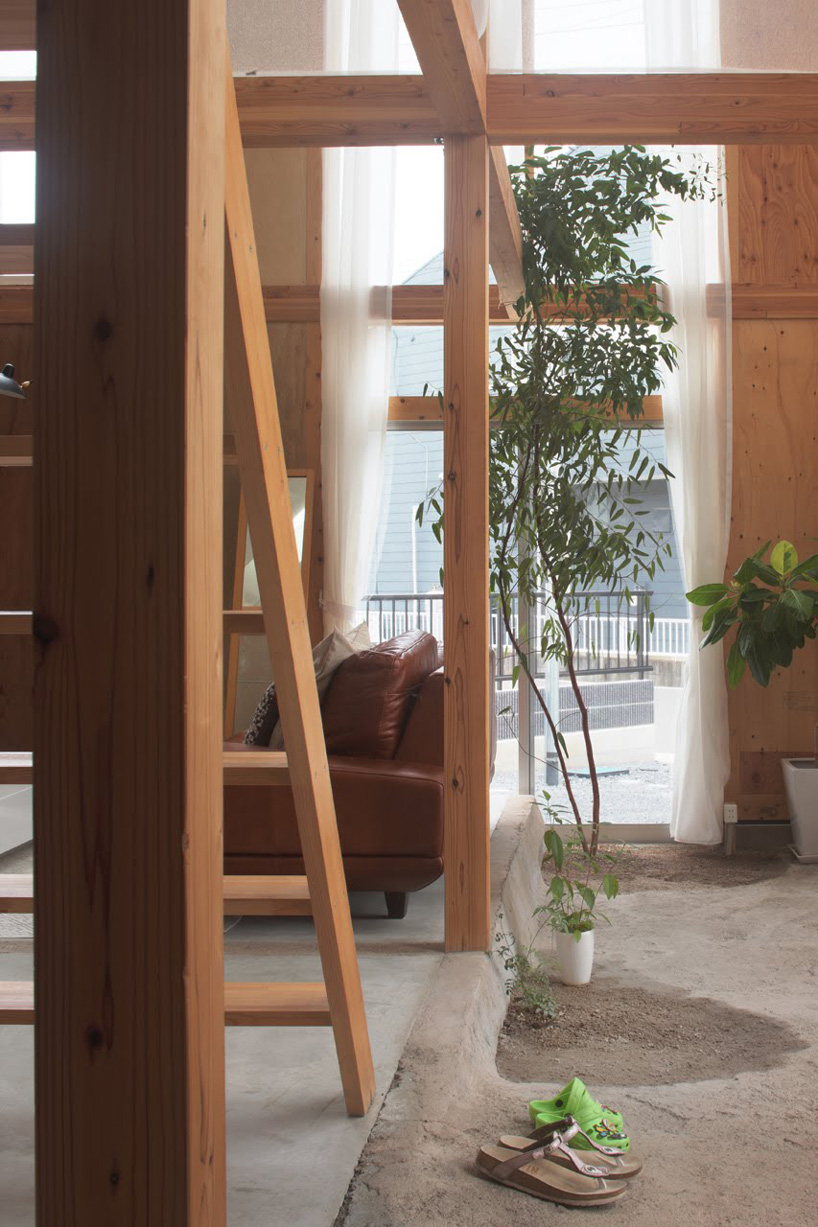  ikimono architects divides areas of this japanese house using a wooden grid