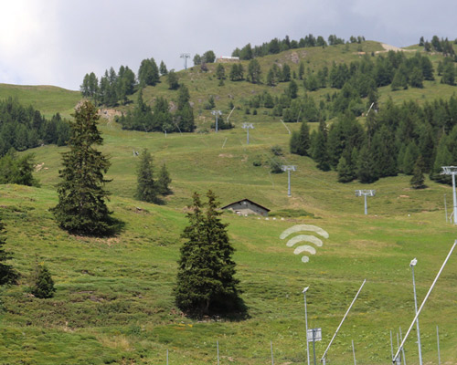 leon keer paints massive wifi symbol on swiss alps