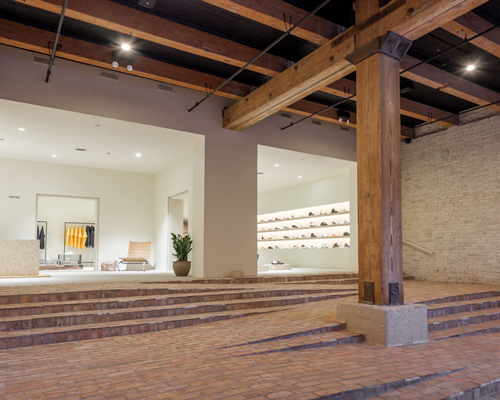 norman kelley remodels 'notre' store in chicago with a multi-purpose stair-ramp