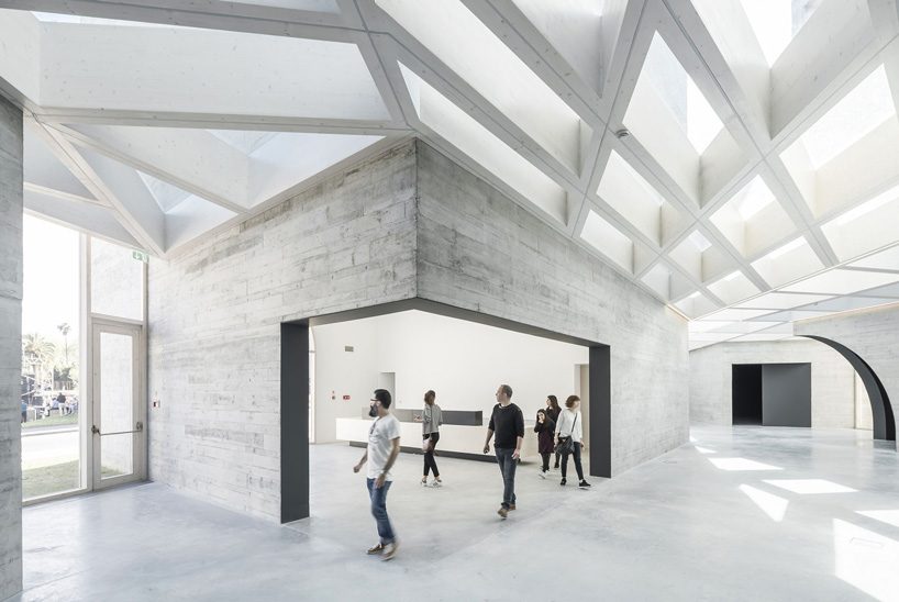 spaceworkers joins varying concrete volumes for romanesque exhibition building in portugal