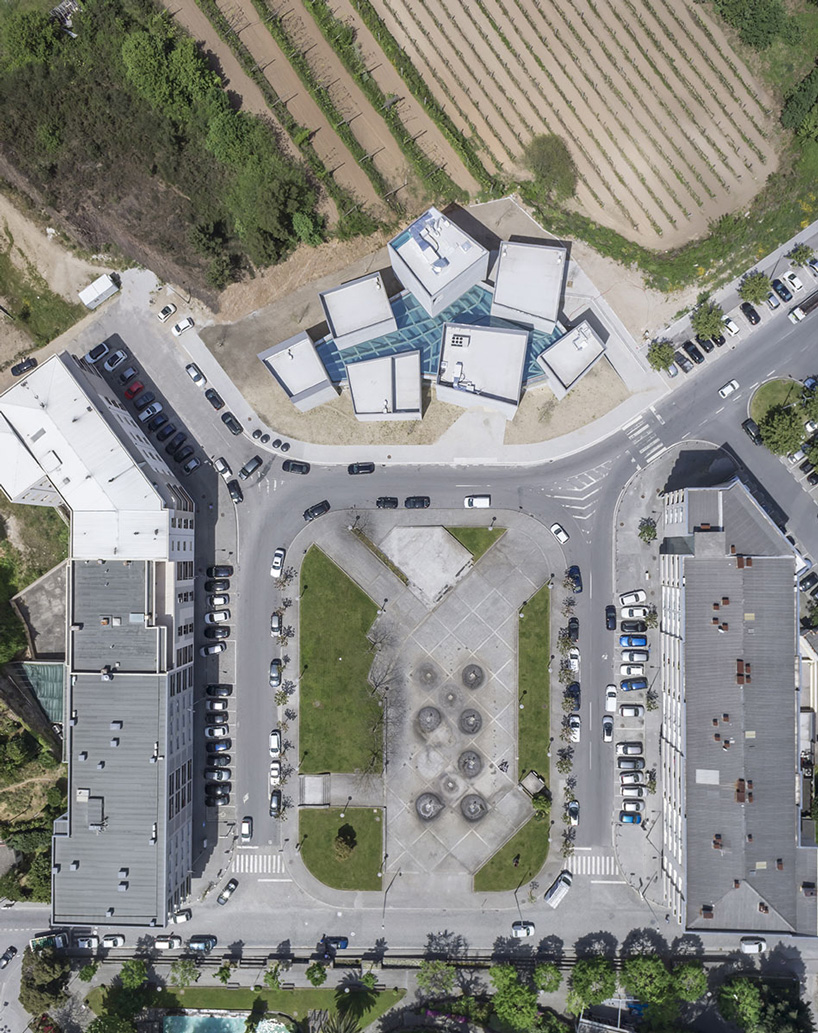 spaceworkers joins varying concrete volumes for romanesque exhibition building in portugal