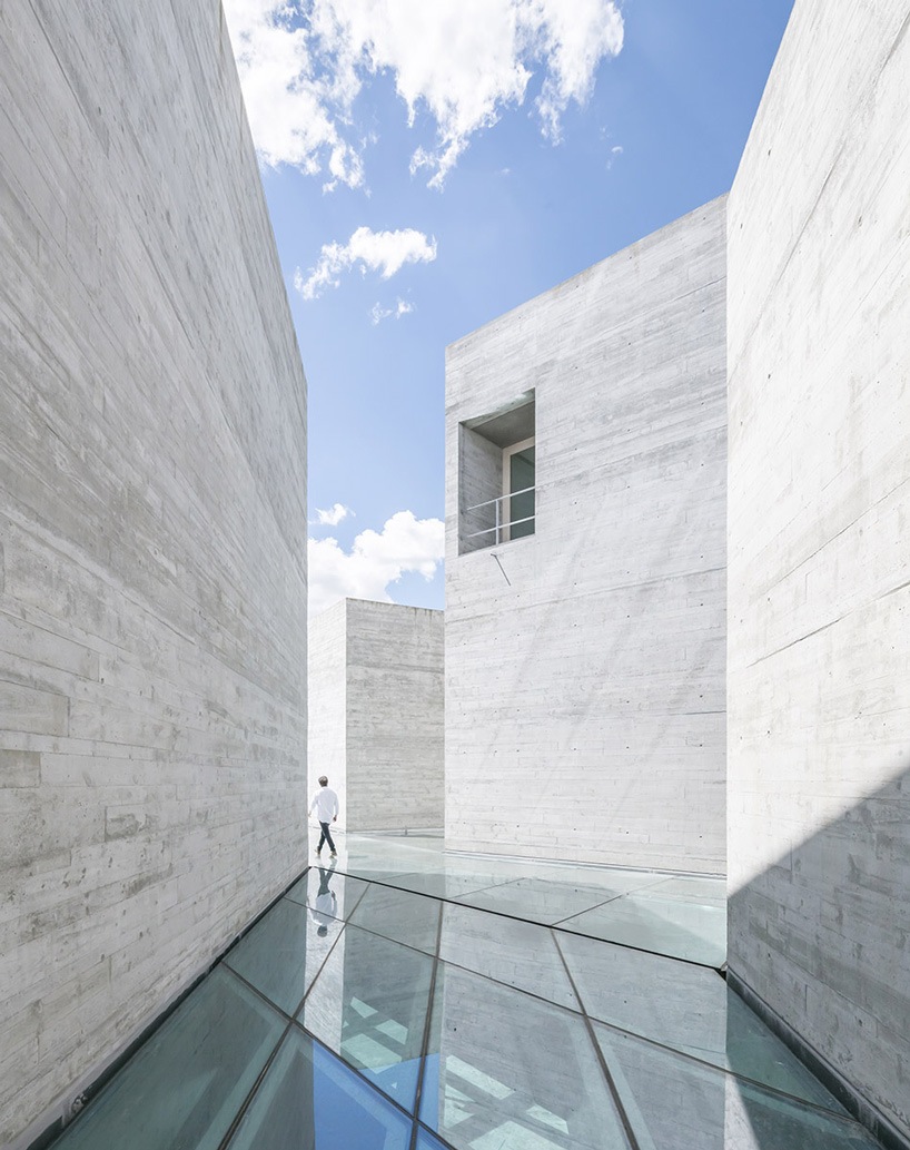 spaceworkers joins varying concrete volumes for romanesque exhibition building in portugal