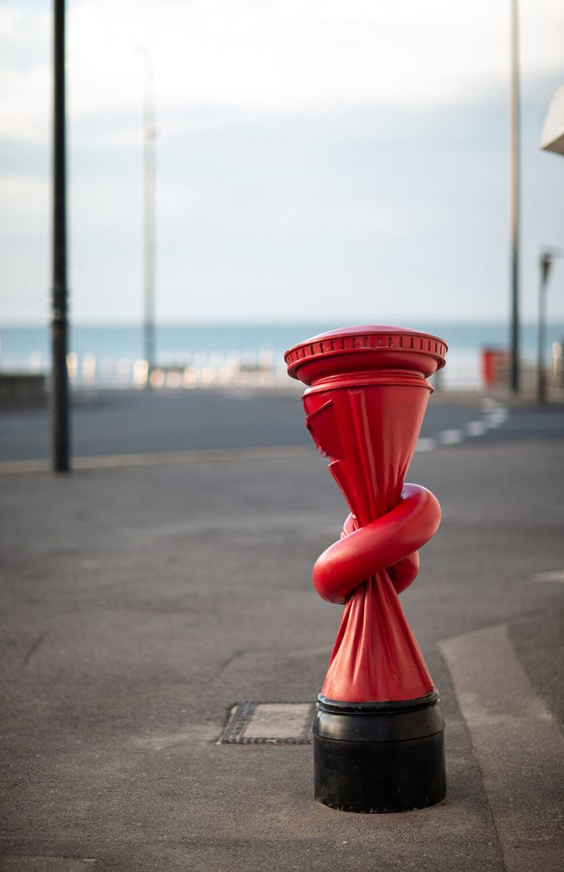 alex chinneck installs 'knotted' post boxes across the UK