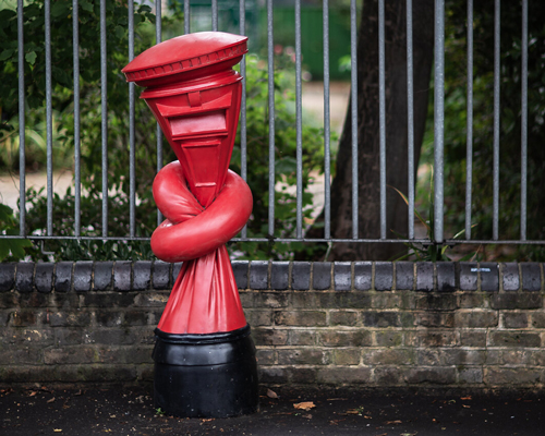 alex chinneck installs 'knotted' post boxes across the UK