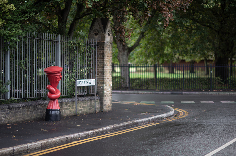 alex chinneck installs 'knotted' post boxes across the UK