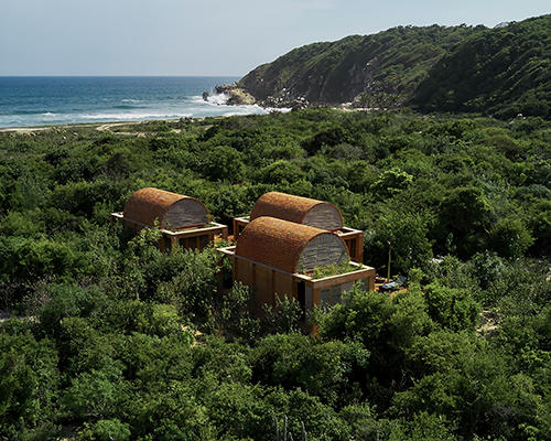 three brick vaults of 'casa volta' float above the lush oaxacan coast
