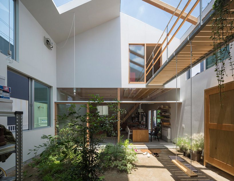 tato architects builds house in tsukimiyama, japan, around covered courtyard