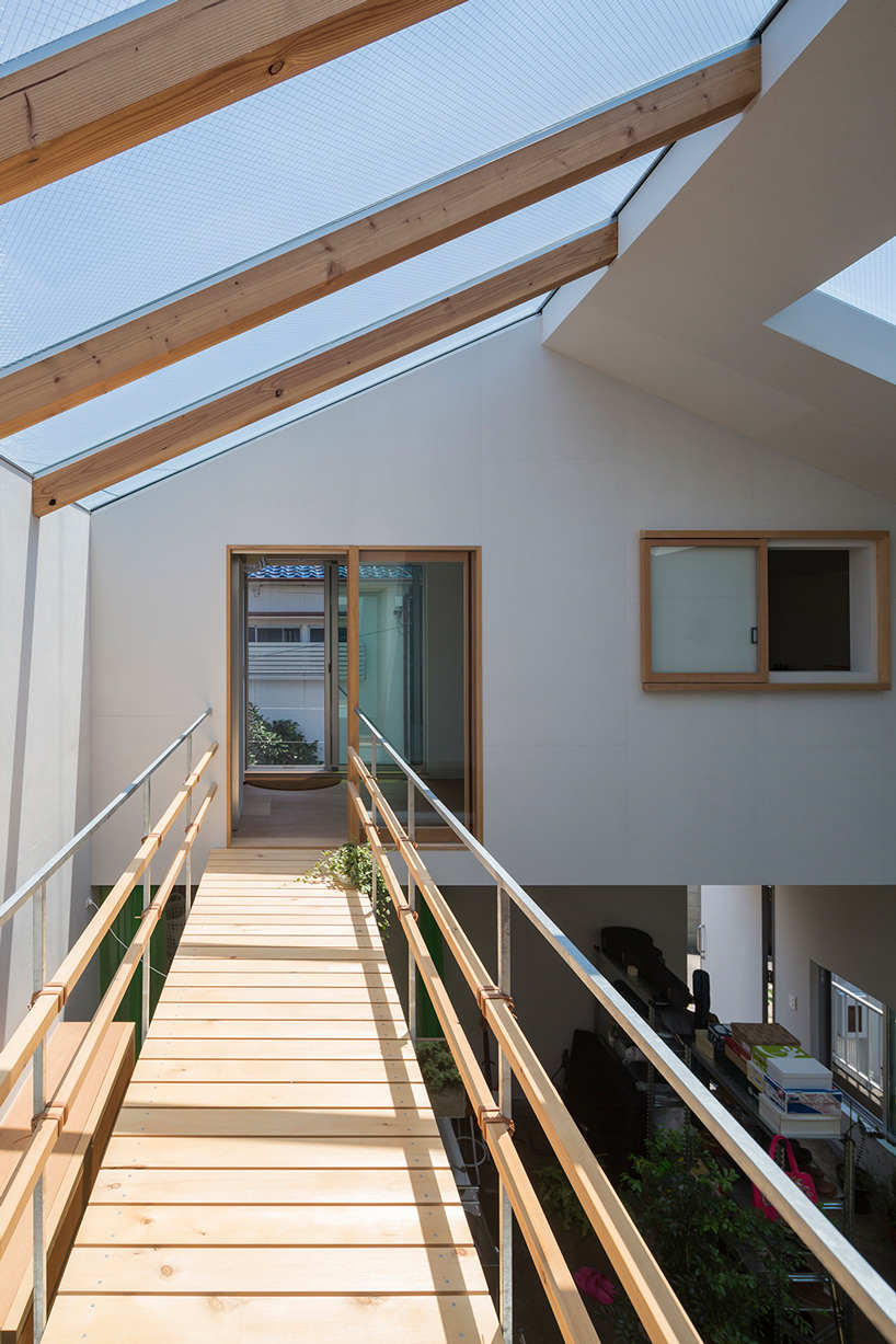 tato architects builds house in tsukimiyama, japan, around covered courtyard
