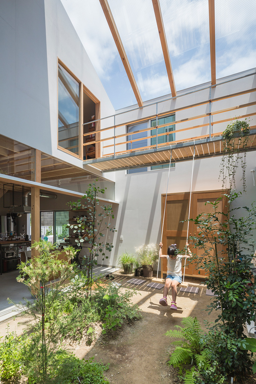 tato architects builds house in tsukimiyama, japan, around covered courtyard