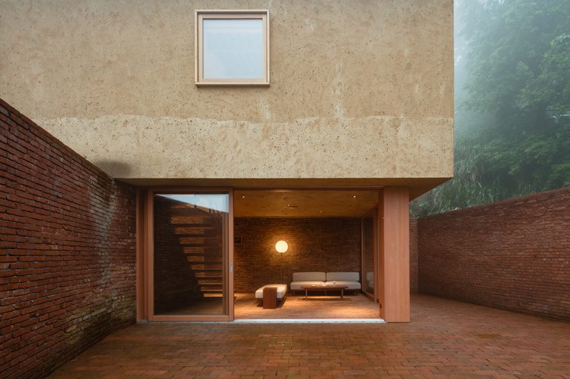 kooo architects rebuilds 'origin villa' hotel in rural china using bamboo, stone + charred wood