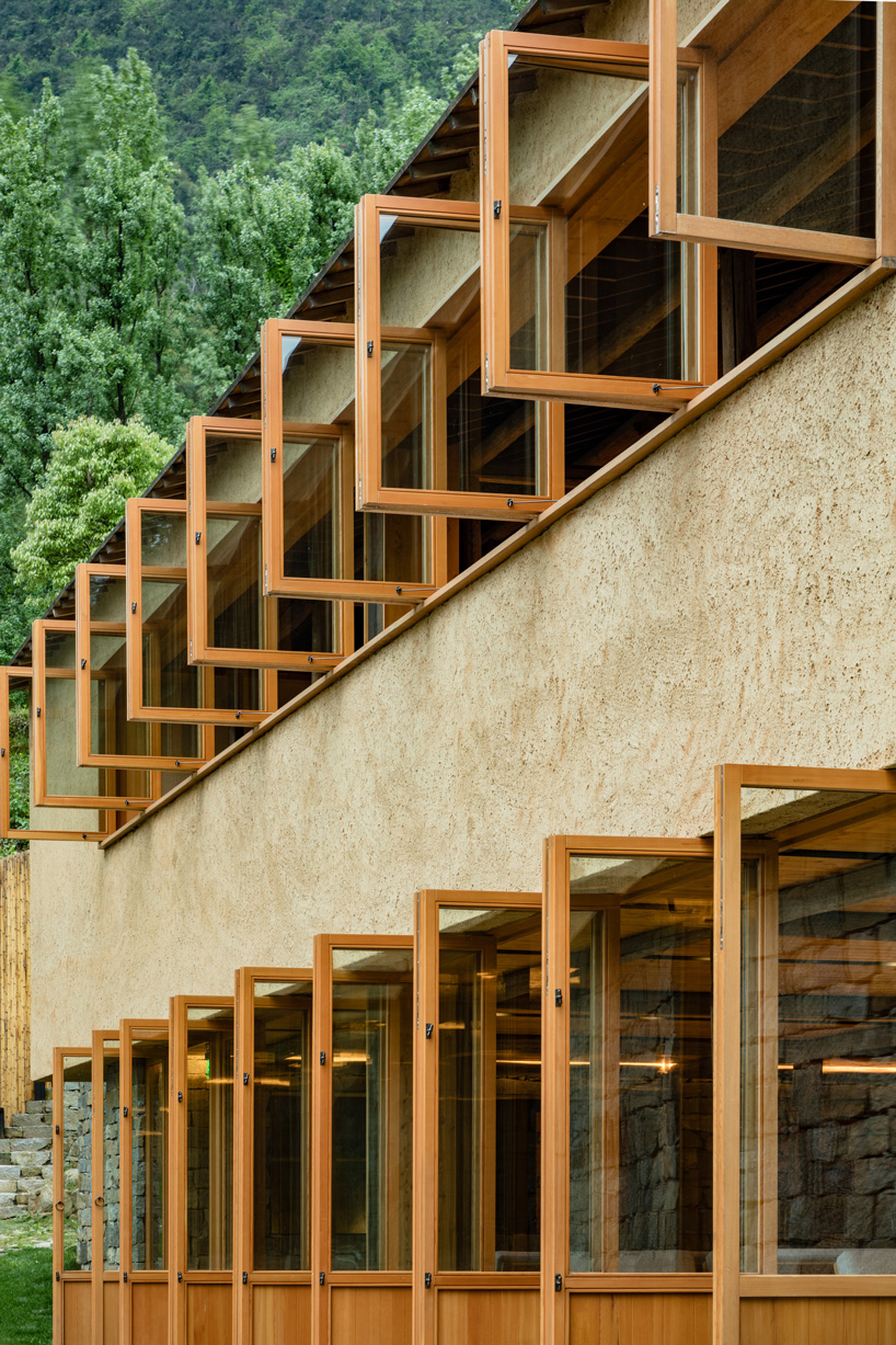 kooo architects rebuilds 'origin villa' hotel in rural china using bamboo, stone + charred wood