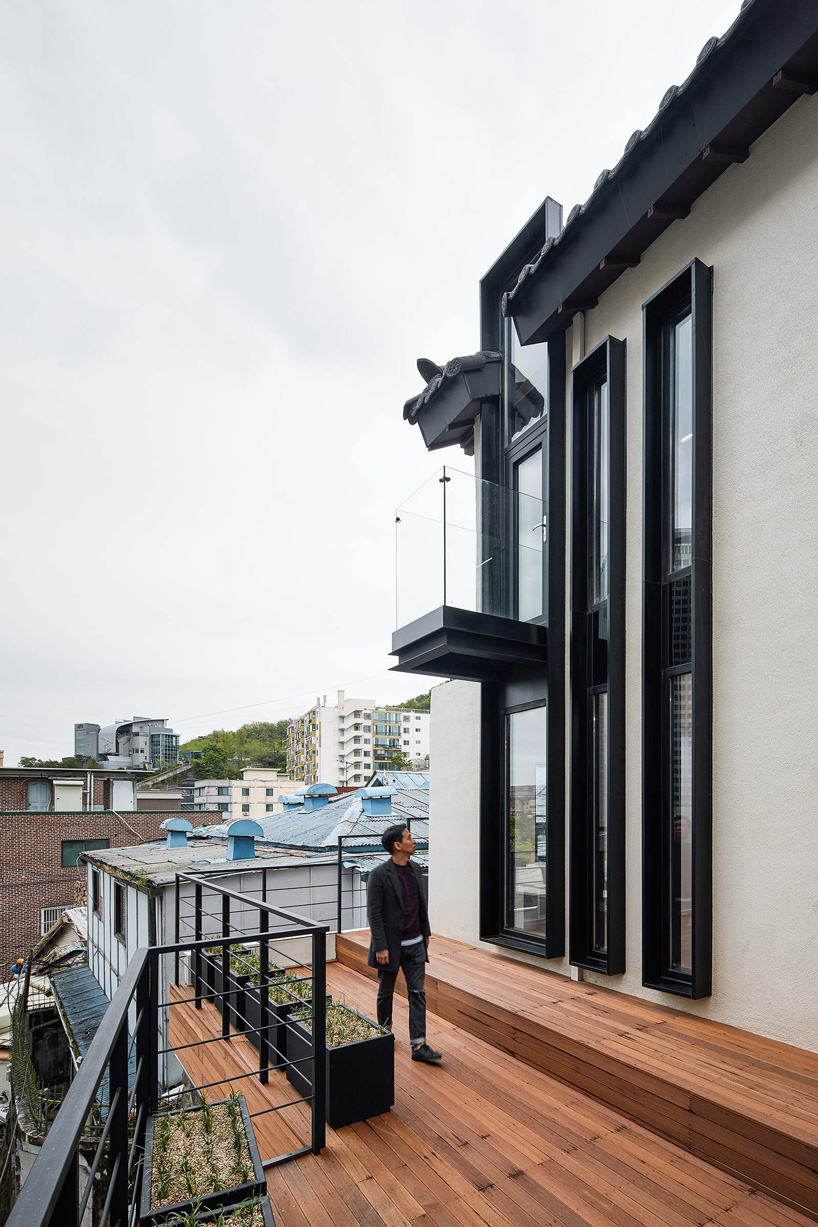 yong ju lee transforms 1930s wooden house into the hoehyeon community building in seoul