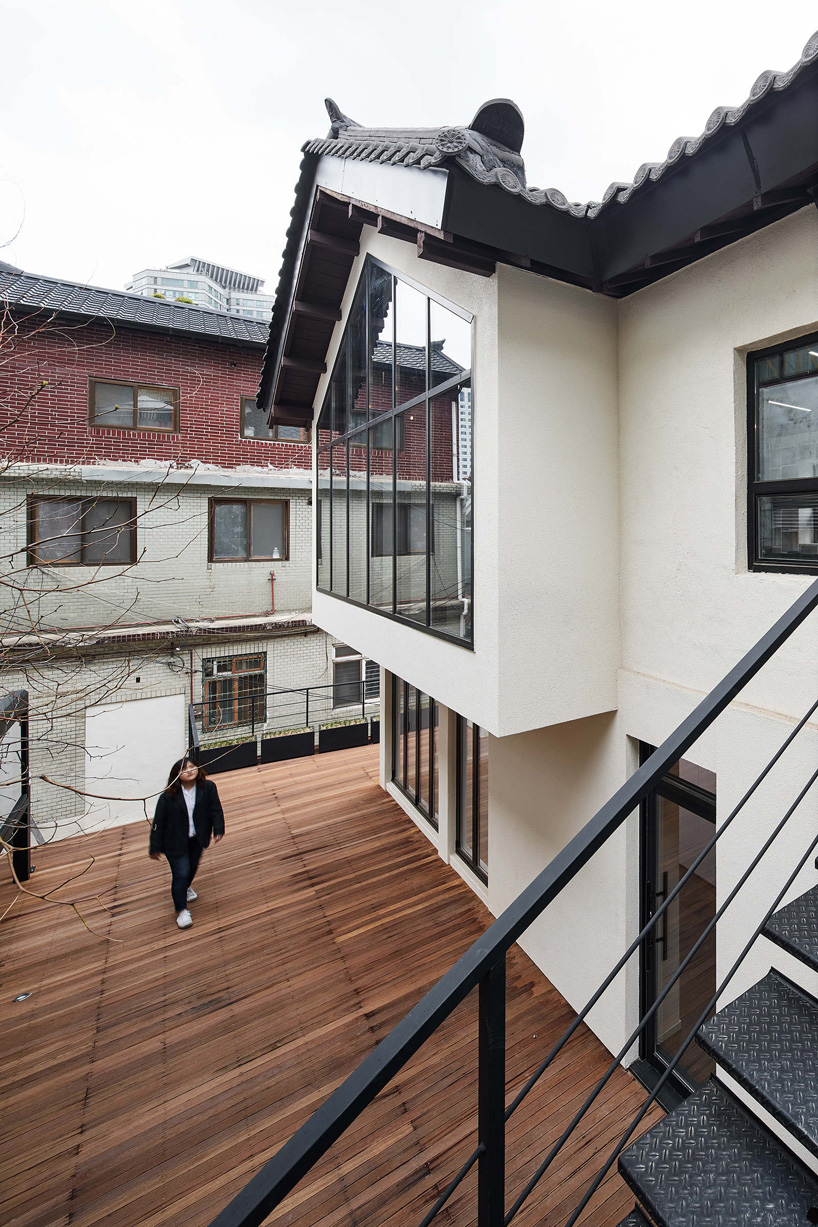 yong ju lee transforms 1930s wooden house into the hoehyeon community building in seoul