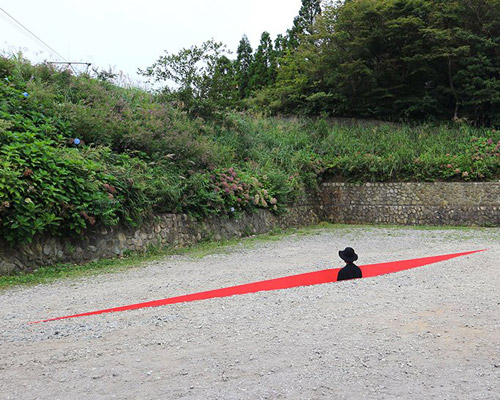 a red wound cuts the earth for hajime yoshida + yoshihiro mikami's land art in japan