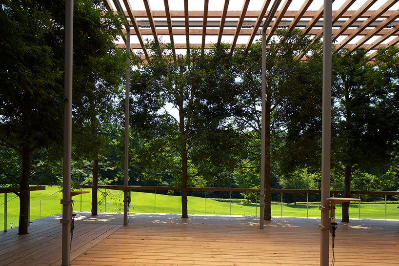 this timber structure in japan disappears against its forested backdrop - 1