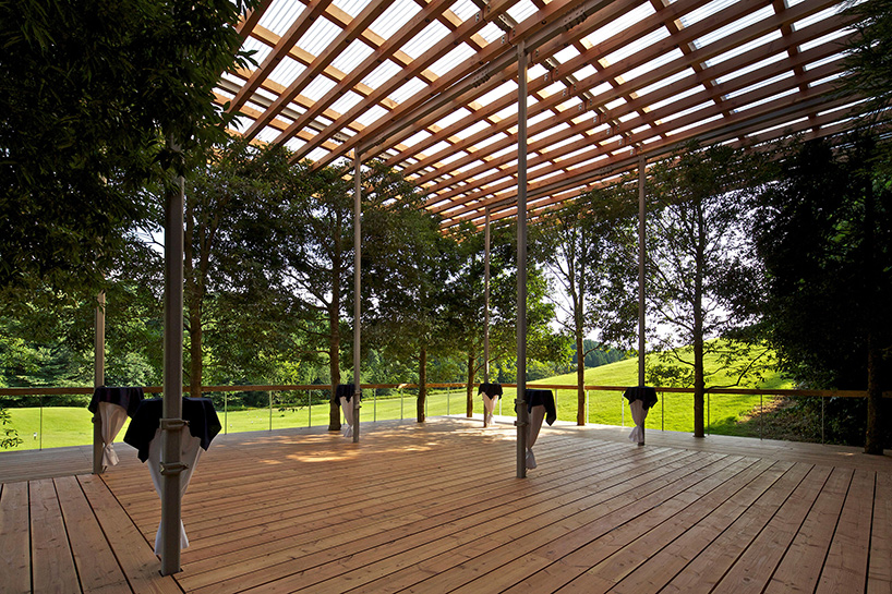this timber structure in japan disappears against its forested backdrop - 2