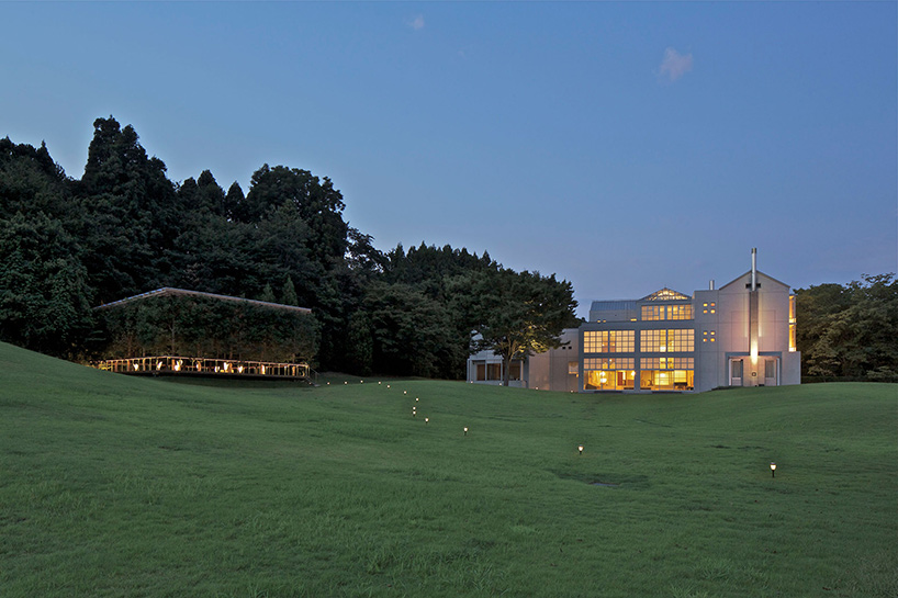 this timber structure in japan disappears against its forested backdrop - 4
