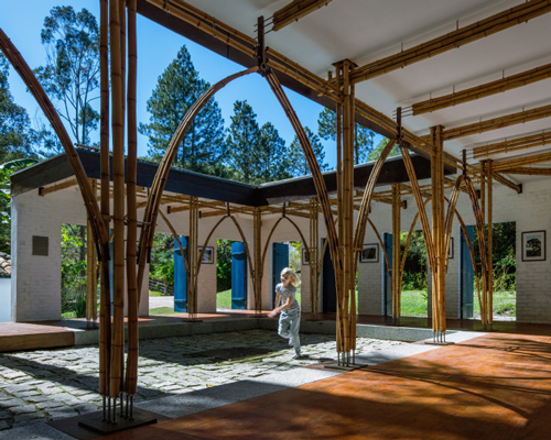 thirteen blue doors provide access to this bamboo art gallery in brazil