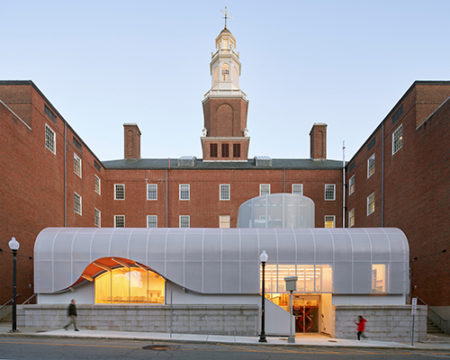 vibrant new face of RISD by WORKac expresses orange detailing and perforated materials