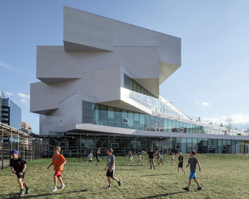 bjarke ingels group's first public school in the US features cascading green terraces