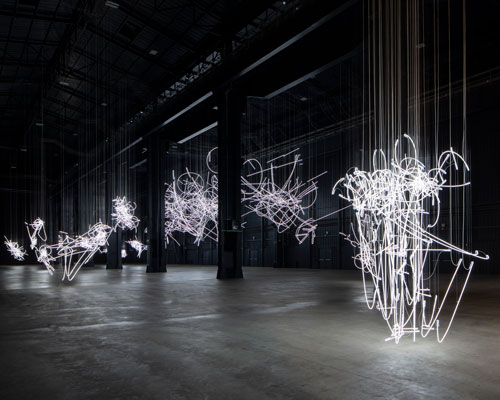 cerith wyn evans hangs neon scribbles in solo exhibition at milan's hangarbicocca 