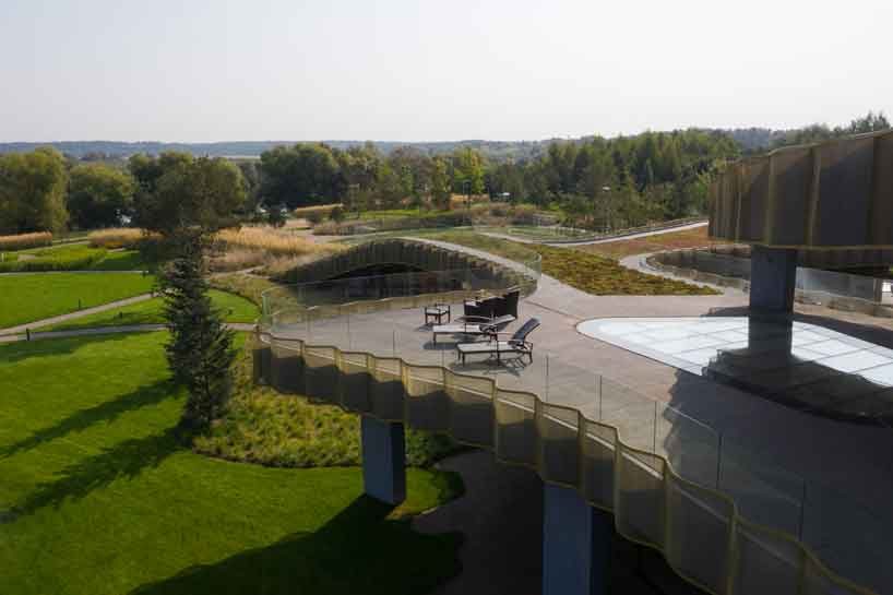 green roofs melt j.mayer.h's n.n. residence into the rolling hills of rural moscow designboom