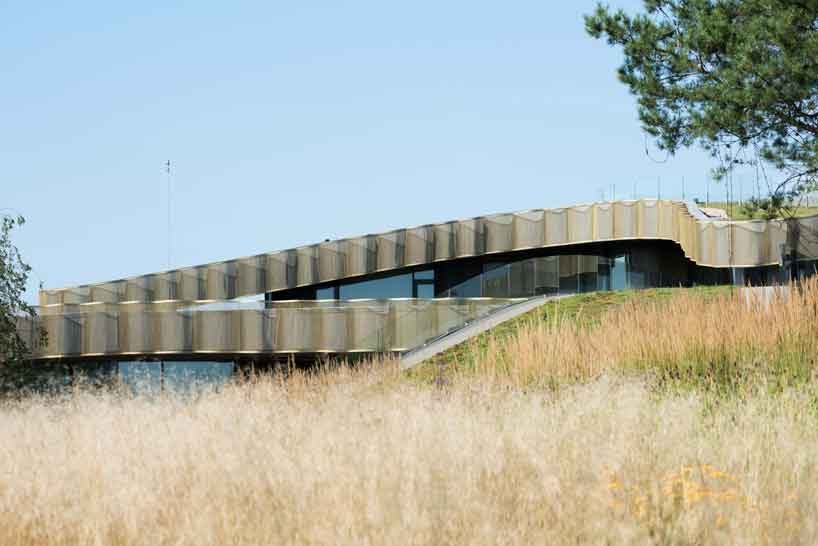 green roofs melt j.mayer.h's n.n. residence into the rolling hills of rural moscow designboom