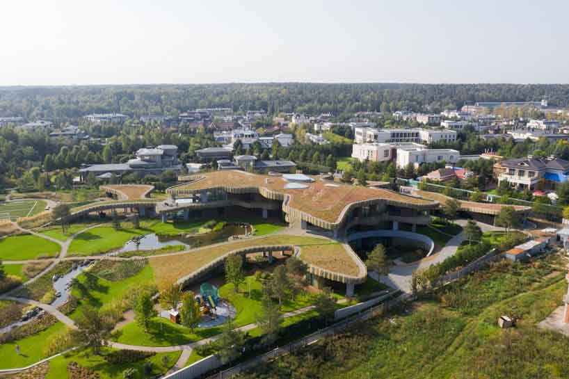 green roofs melt j.mayer.h's n.n. residence into the rolling hills of rural moscow designboom