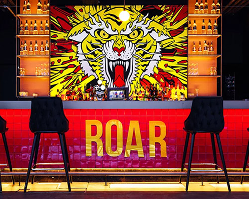 kissmiklos applies colorful illustrations to design CAT bar and dance club in budapest
