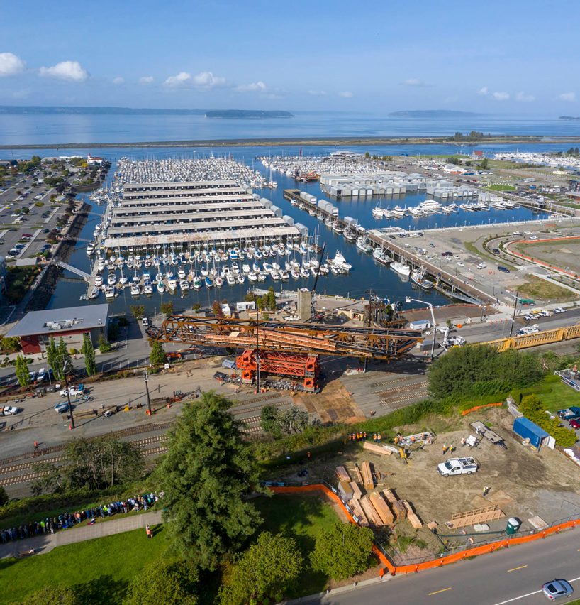 LMN architects utilizes weathered steel trusses to build pedestrian bridge in washington designboom