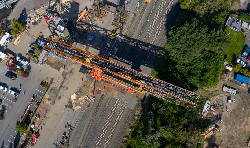 LMN architects utilizes weathered steel trusses to build pedestrian bridge in washington designboom