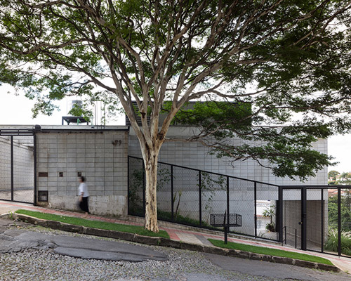 stepped concrete volumes form the casa comiteco residence and wine tasting space in brazil