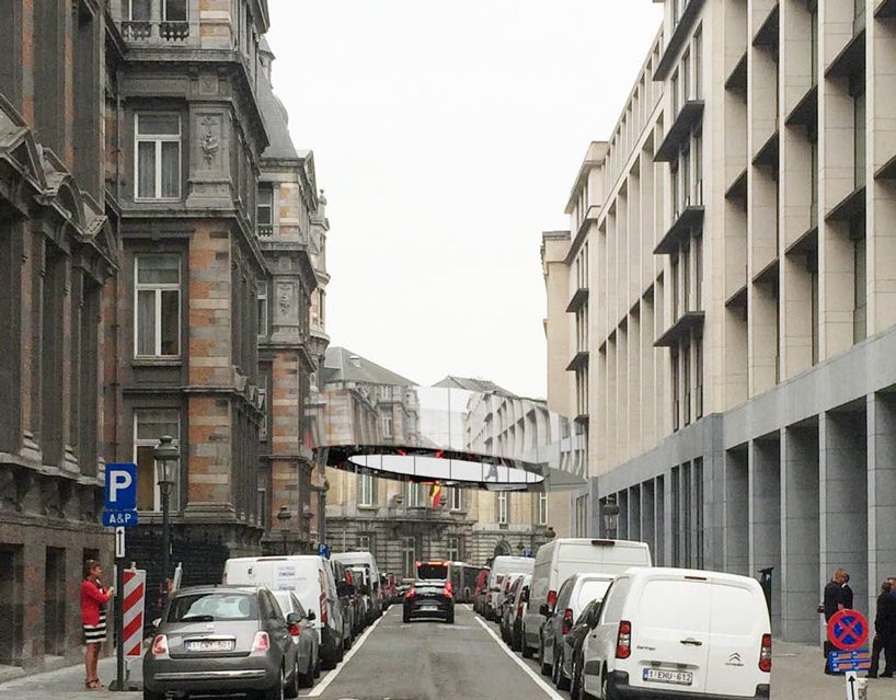 office KGDVS plans 'tondo', a tilted circular footbridge coated with mirrors in brussels