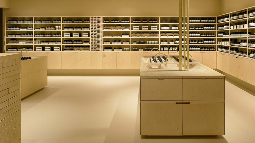 schemata architects creates 'soft beige mirage' inside aesop store in japan